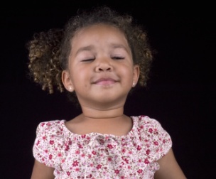 Child taking deep breaths to calm down Child taking deep breaths to calm down